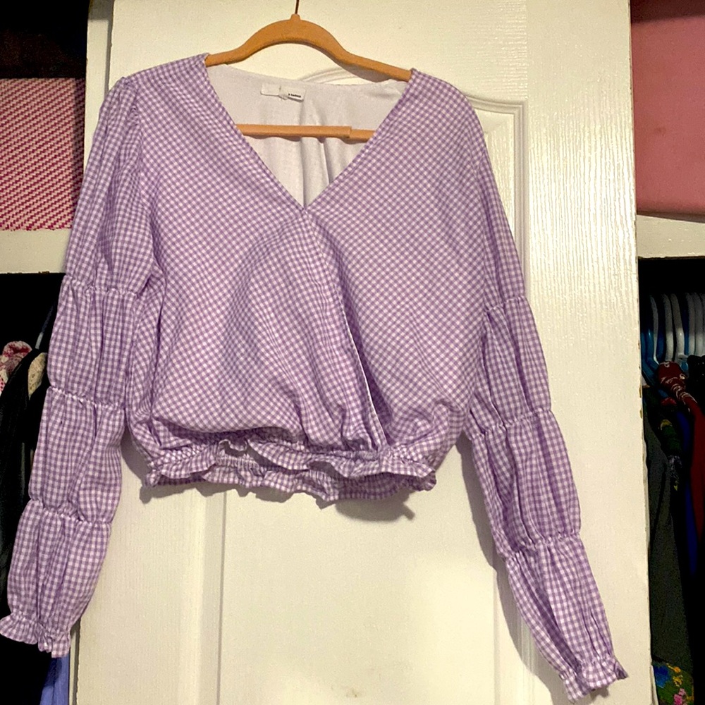 Purple top hasn’t been worn is super cute size medium